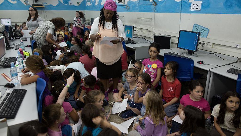 Israeli children have a lesson underground as part of an air raid drill 