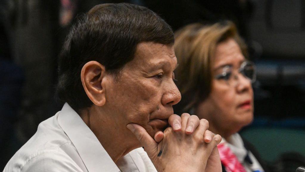 Former Philippine president Rodrigo Duterte and former senator and human rights campaigner Leila de Lima attend a senate probe