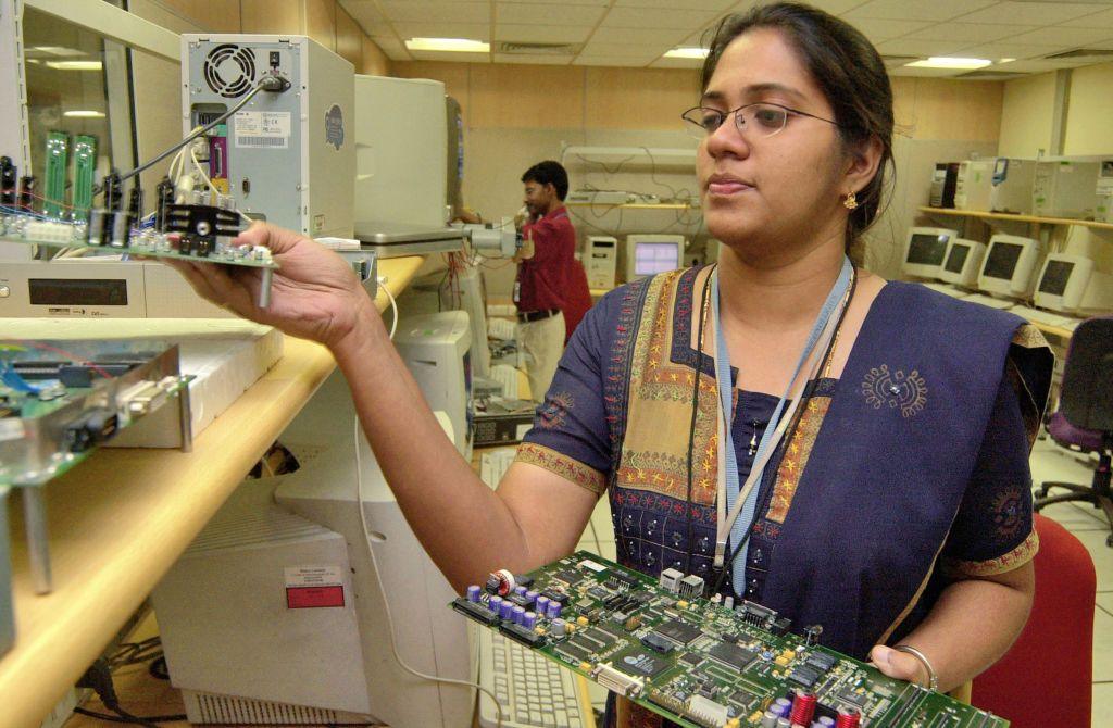 A woman works in office, Bangalore, Karnataka, India.