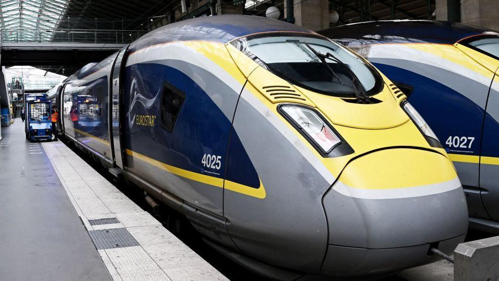 A Eurostar train waits on the platform