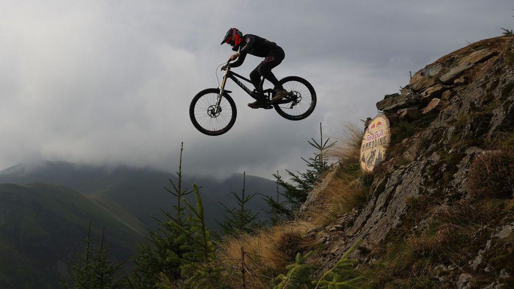 Kaos Seagrave on his bike in mid-air