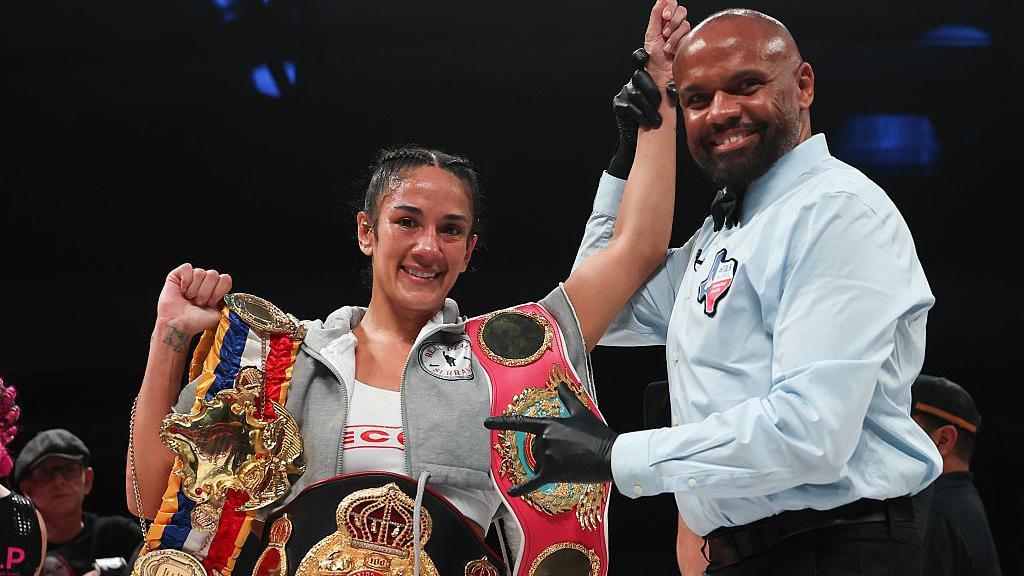Amanda Serrano with her titles