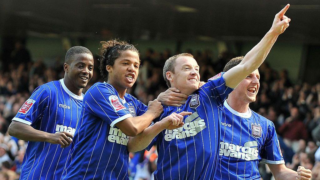 Ipswich players celebrate scoring against Norwich