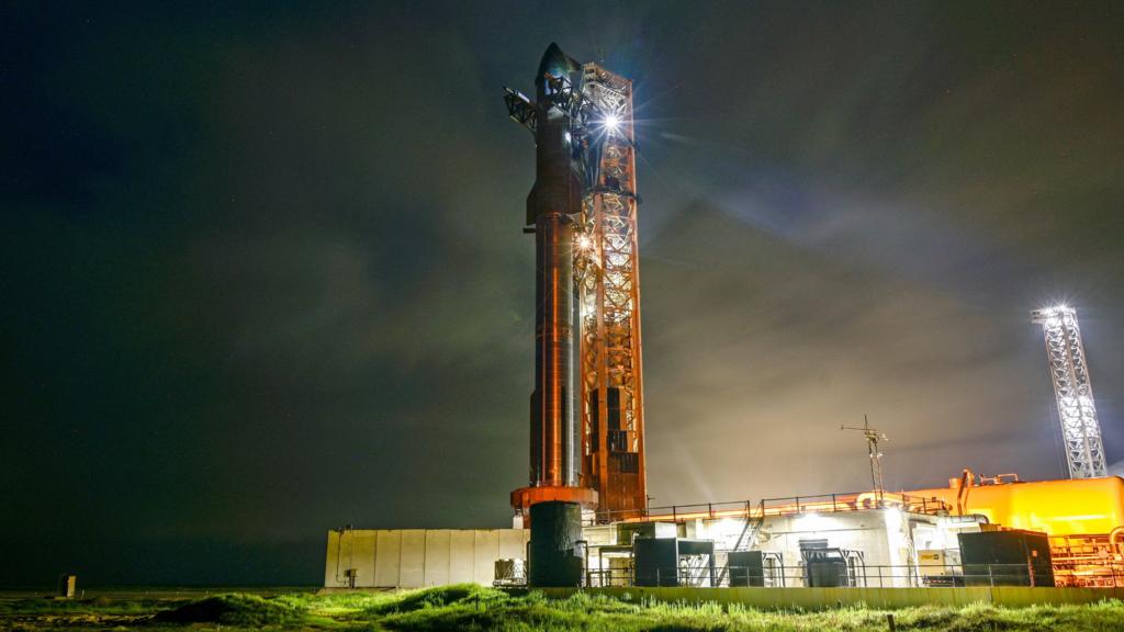 A SpaceX Starship spacecraft sits atop a super heavy booster at the launch pad before its scheduled tenth test flight, at the company's complex in Starbase, Texas