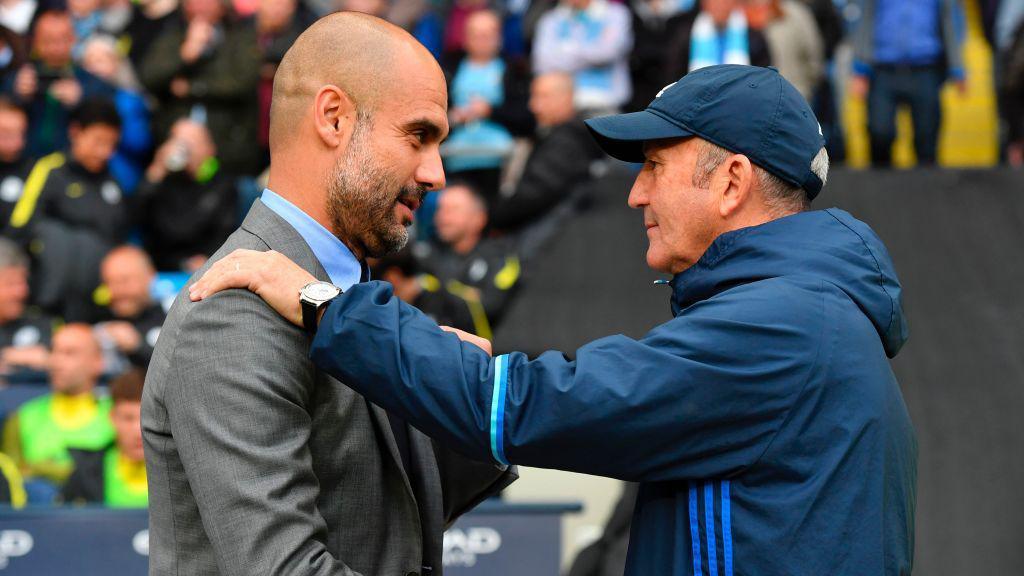 Pulis (right) met with Manchester City boss Pep Guardiola as part of his plan to help young players