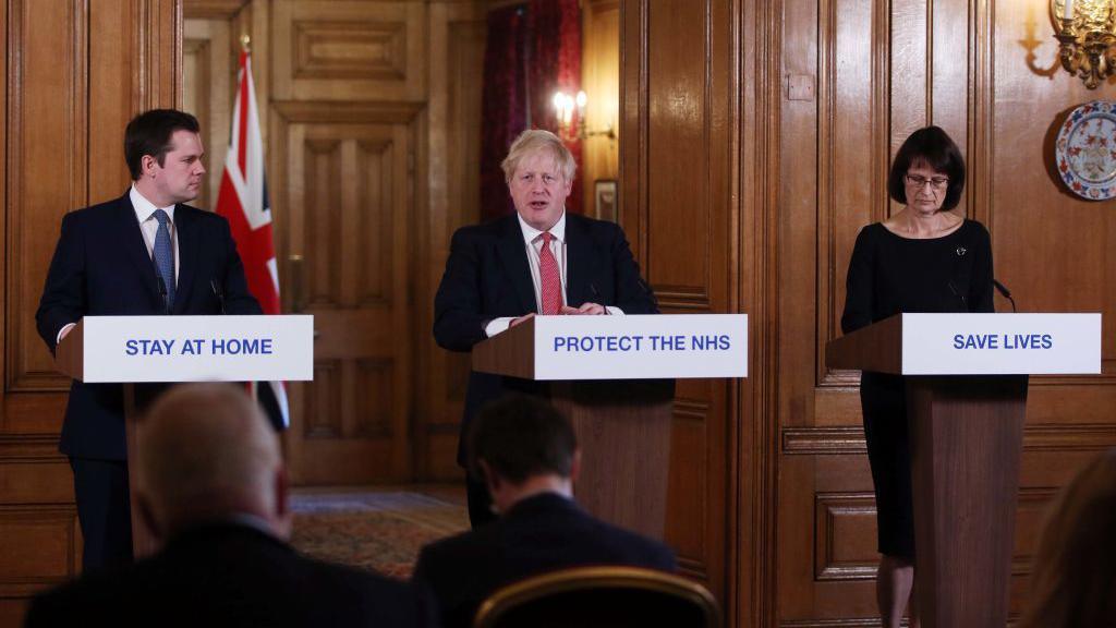 Robert Jenrick with Boris Johnson and Deputy Chief Medical Officer for England Jenny Harries deliver a Covid briefing to journalists at Downing Street in March 2020 