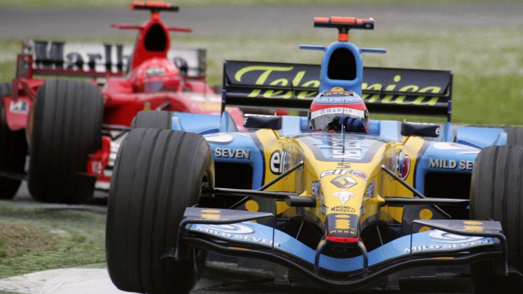 Fernando Alonso and Michael Schumacher battling at the San Marino Grand Prix in 2005.
