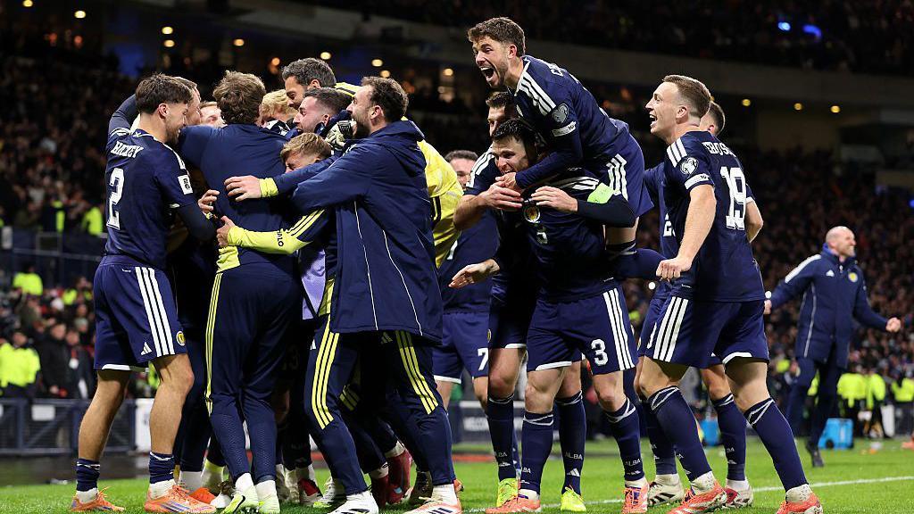 Scotland celebrating during their match against Denmark.