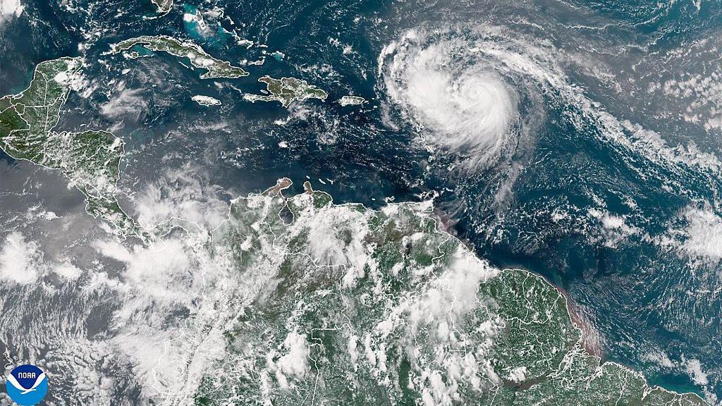 A satellite image shows Hurricane Erin advancing in the Atlantic Ocean