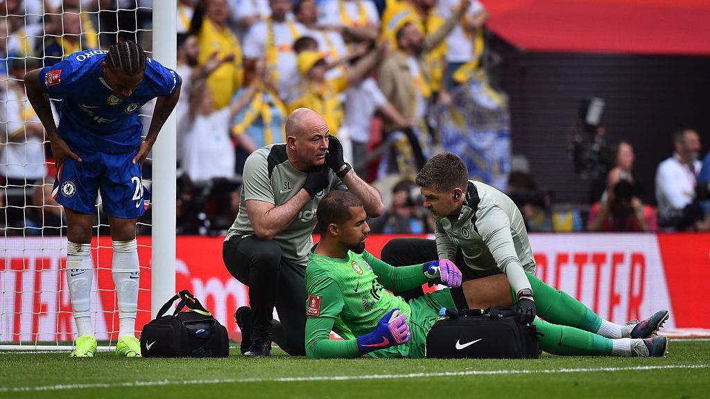 Robert Sanchez receives treatment for an injury