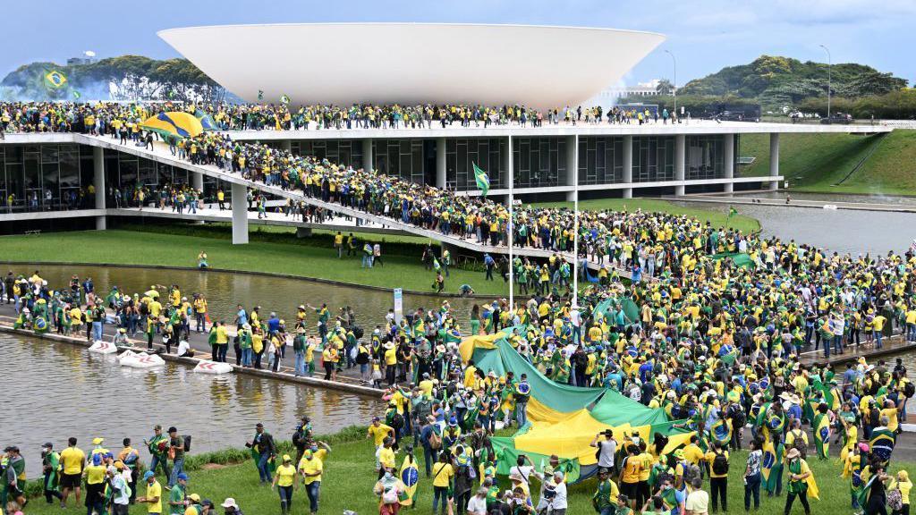 Supporters of Jair Bolsonaro descend on the Esplanada dos Ministerios in Brasilia on 8 January 2023