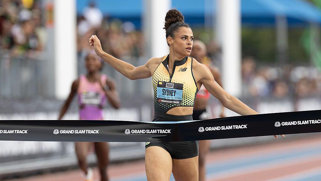 Sydney McLaughlin-Levrone runs through tape at the line as she wins Grand Slam Track's 400m hurdles event in Miami