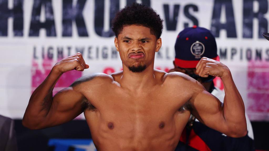 Shakur Stevenson holds up his arms