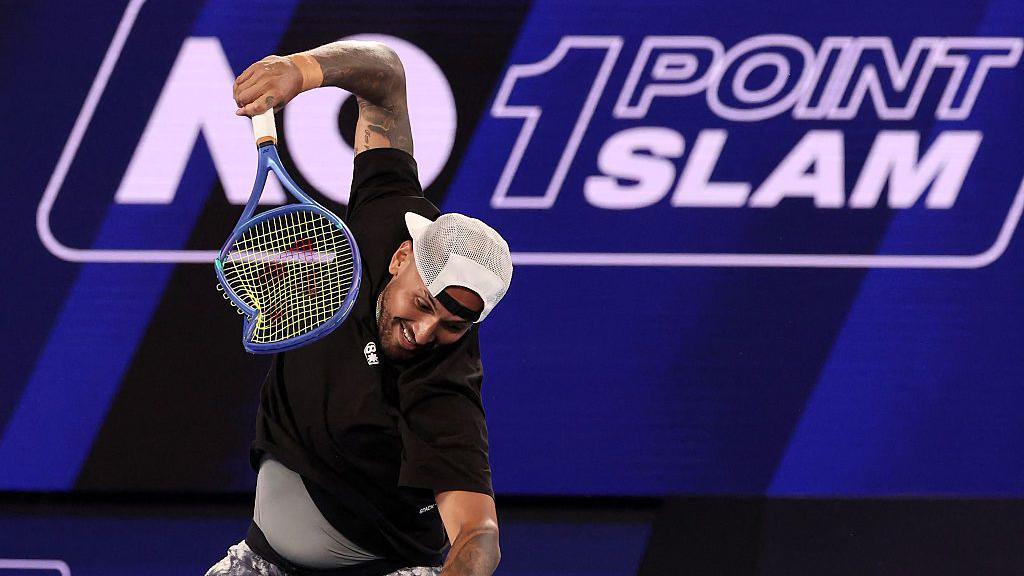 Nick Kyrgios smashes his racquet after going out of the Million Dollar One Point Slam 