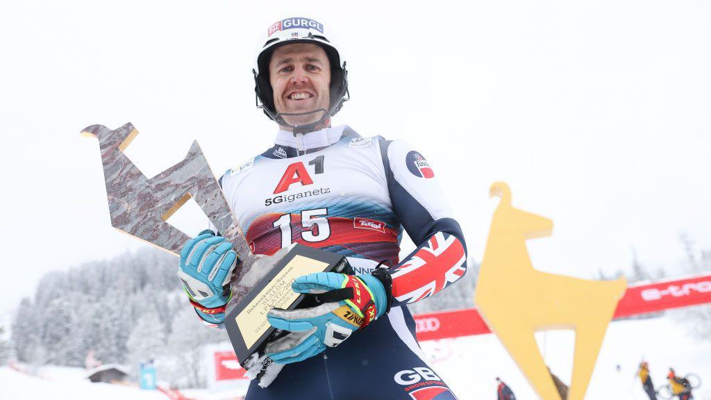 Dave Ryding holds his World Cup trophy in Kitzbuhel in 2022