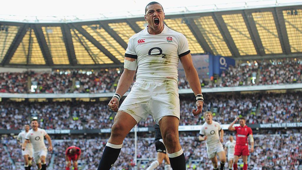 Luther Burrell celebrates a try for England