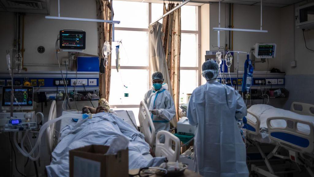 Medical staff attend to Covid-positive patients in the ICU ward at the Holy Family hospital on May 06, 2021 in New Delhi, India. 