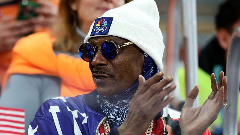 Snoop Dogg applauding at the Winter Olympics 