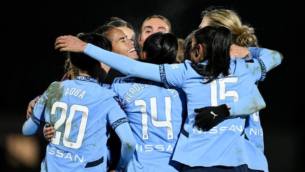 Manchester City celebrating after their second goal. 