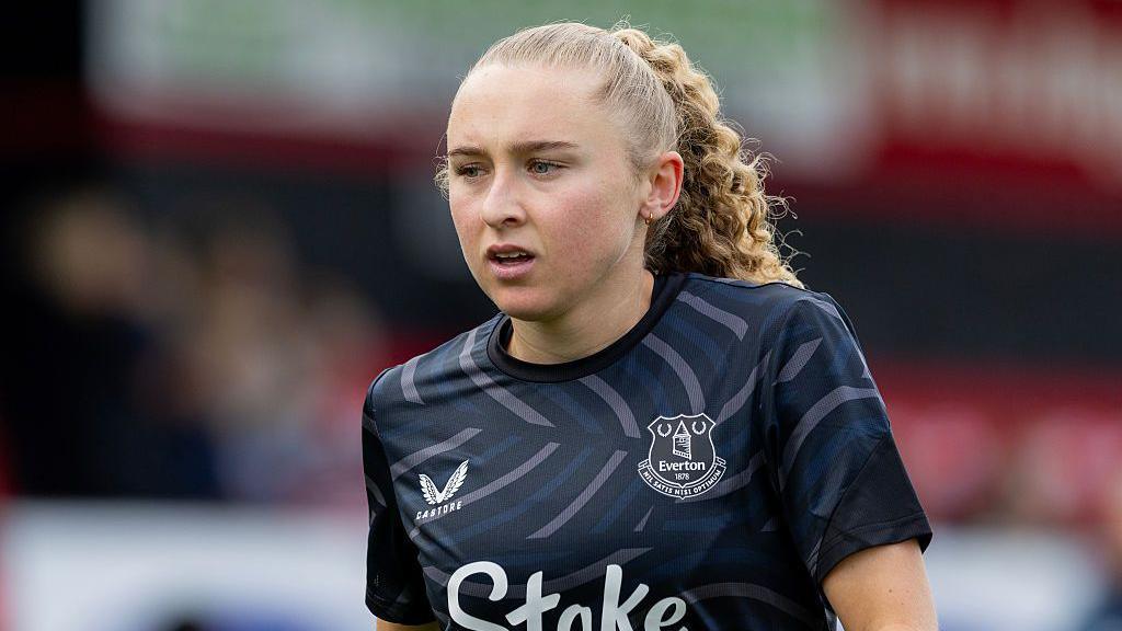 Katie Robinson standing on the pitch during a match for Everton