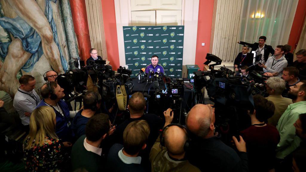 Luke Littler faces the media after losing the final of the World Darts Championship