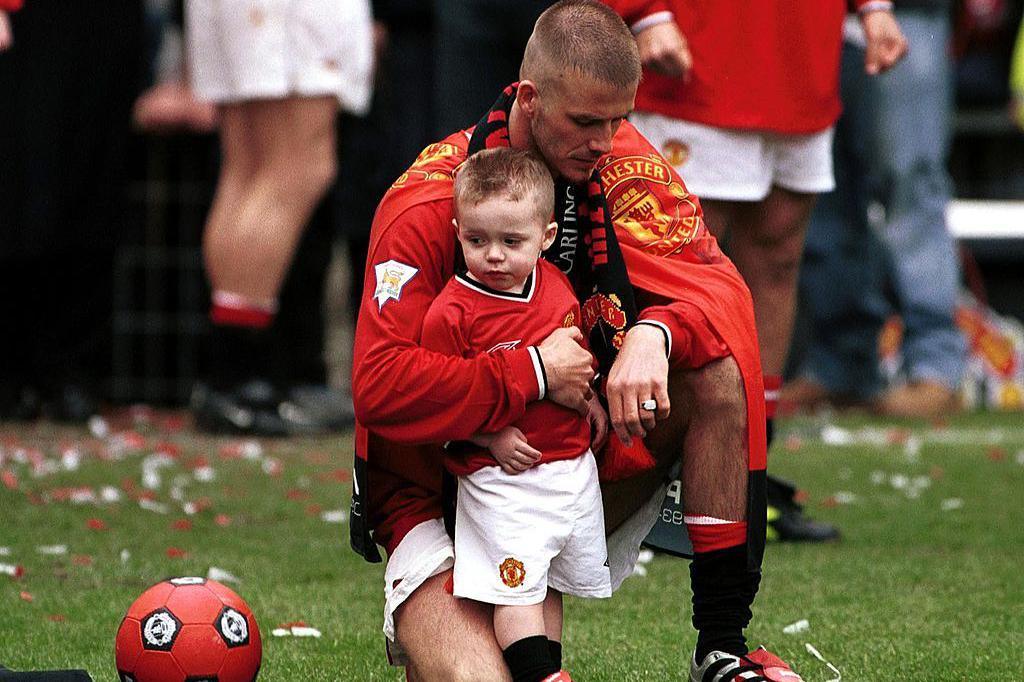 David Beckham and son Brooklyn on the Old Trafford pitch in 2001