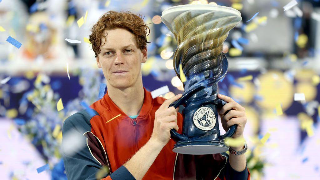 Jannik Sinner holds the Cincinnati Open trophy 