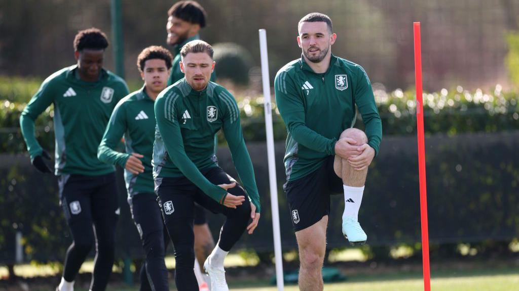 John McGinn leads the stretching