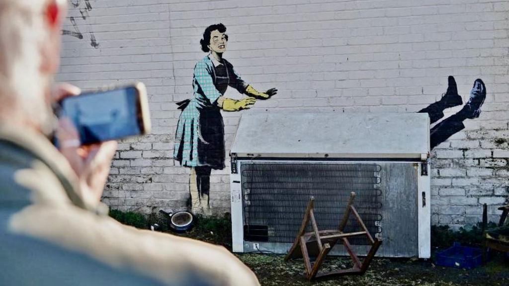 Waking up with a Banksy on your wall: The differing fortunes of two homeowners