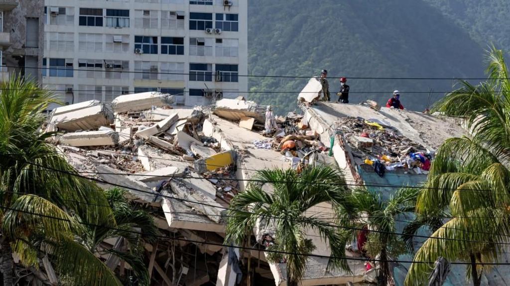 A damaged building is seen from the base camp of the French Civil Security Training and Intervention Regiment (UIISC 7) at the Karting La Guaira complex in Caraballeda, La Guaira state