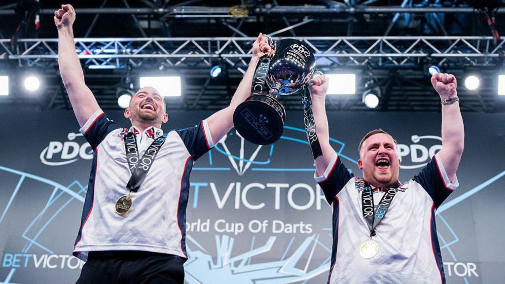 Luke Humphries and Luke Littler lift the World Cup of Darts trophy