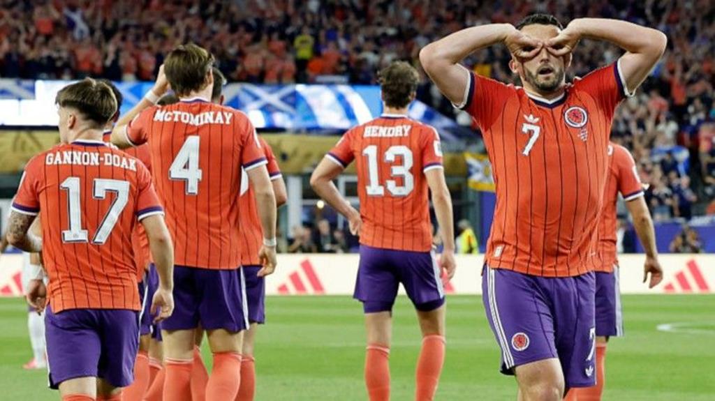 John McGinn celebrates scoring for Scotland