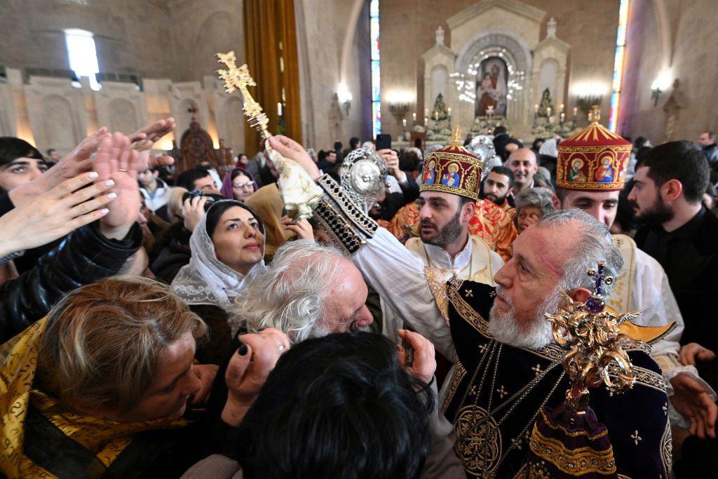 An Armenian Apostolic Christian prays during a service at Saint Gregory the Illuminator Cathedral, as the Armenian Apostolic Church celebrates Christmas, in Yerevan on January 6, 2024