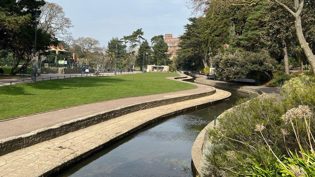 Lower gardens in Bournemouth. there are plants and a stream running through a green park