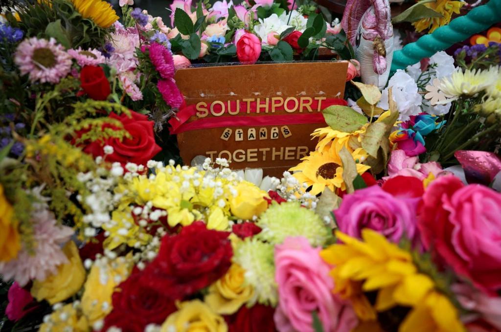 Floral tributes left by members of the public are seen following the fatal knife attack on three young girls in July in Southport,
