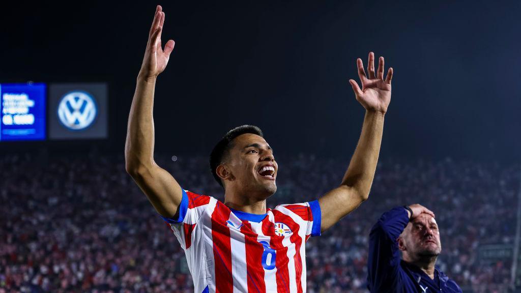 Diego Gomez celebrates after Paraguay beat Argentina in a World Cup qualifier