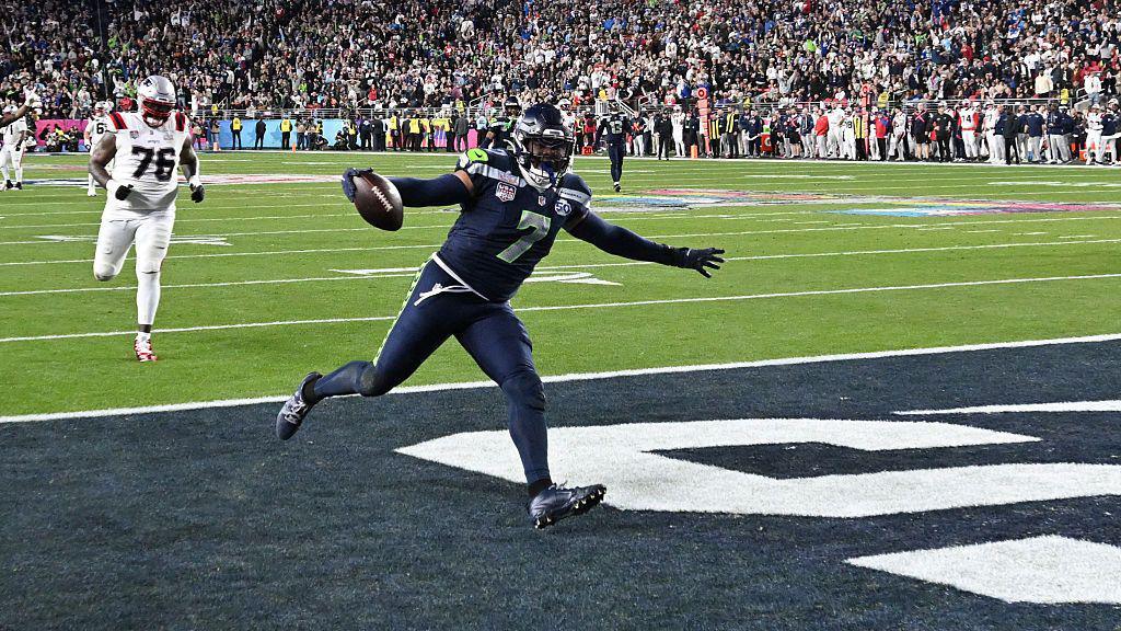 Seattle Seahawks' linebacker Uchenna Nwosu scores a touchdown during Super Bowl LX