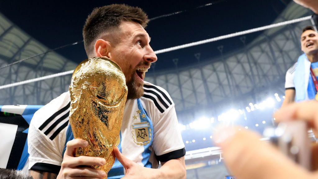 Lionel Messi holds the World Cup trophy