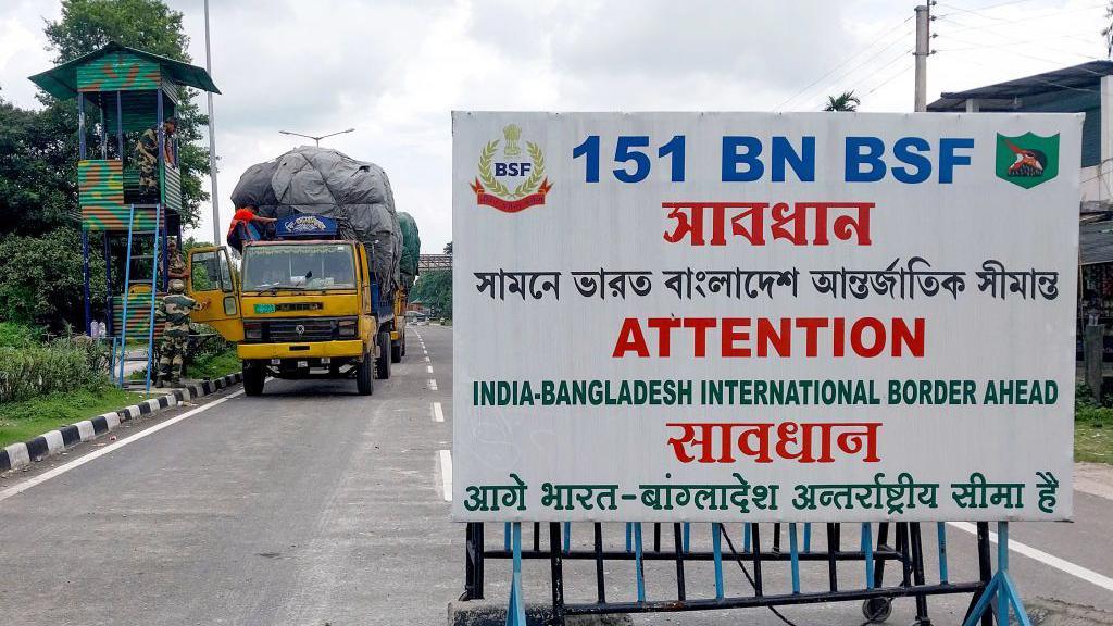 Border Security Force (BSF) personnel inspect a truck carrying supplies to Bangladesh at the India-Bangladesh border in Fulbari on the outskirts of Siliguri on August 7, 2024.
