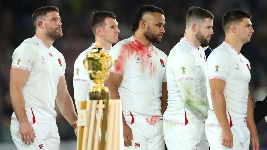 England players walk past the World Cup trophy after defeat by South Africa in the 2019 final
