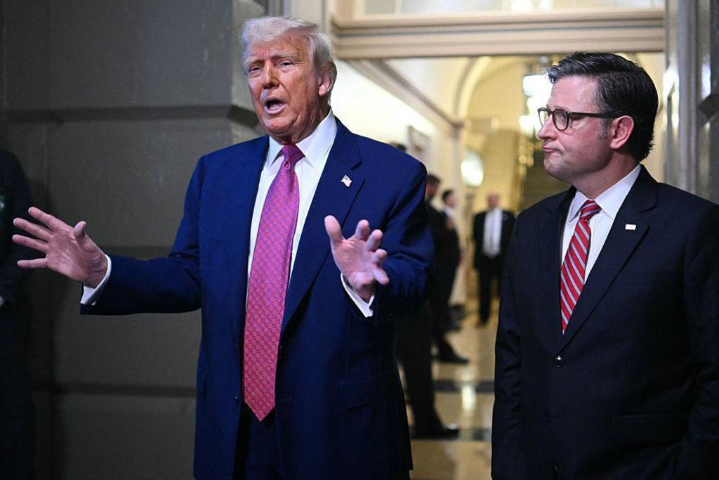 US President Donald Trump and US Speaker of the House Mike Johnson (R-LA) speak to the press after a House GOP Conference Meeting at the US Capitol in Washington, DC on May 20, 2025. US President Donald Trump rallied Republicans on Capitol Hill Tuesday to back a so-called "big, beautiful bill" that is likely to increase the yawning budget deficit and cut health care for millions of Americans. (Photo by Mandel NGAN / AFP) (Photo by MANDEL NGAN/AFP via Getty Images)