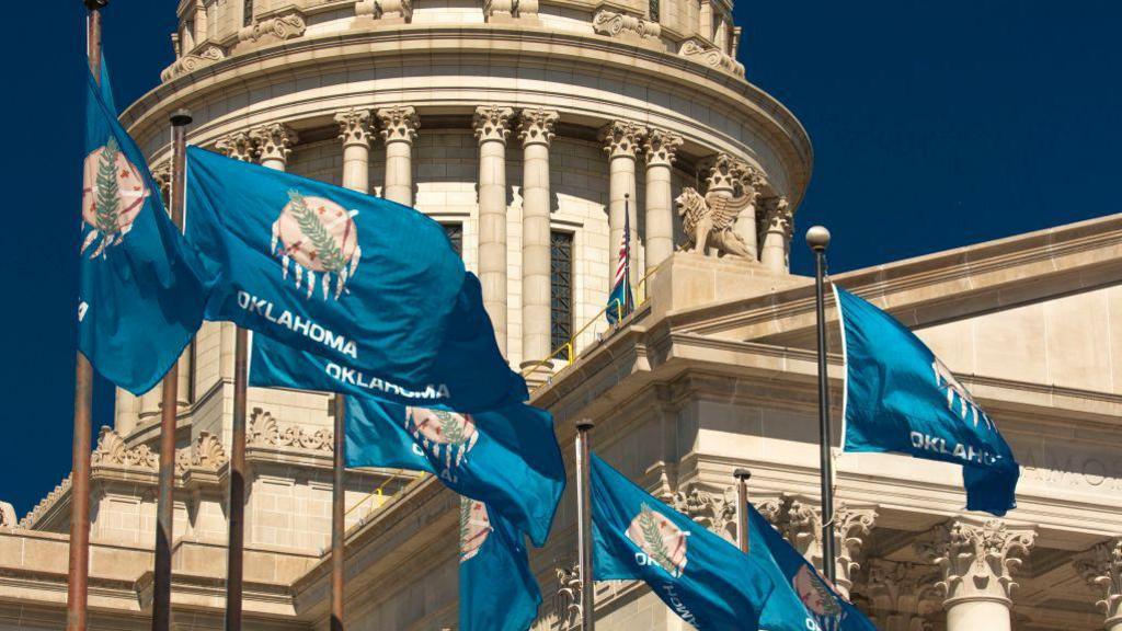 Oklahoma flags at the state's capitol building