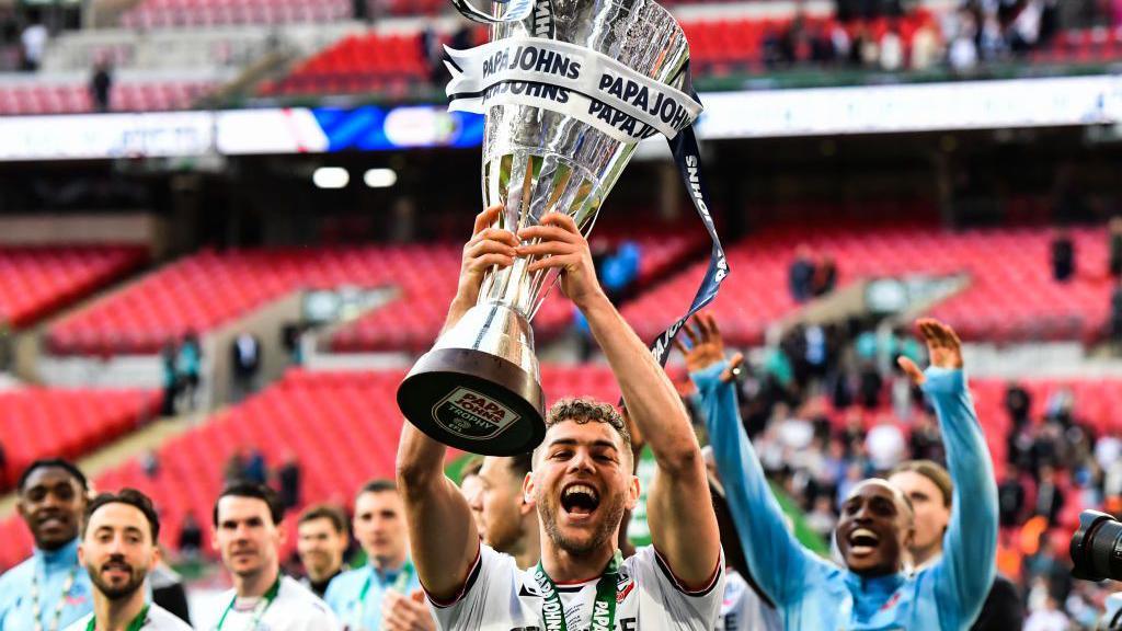 Dion Charles with the trophy after the Papa John Trophy Final between Bolton Wanderers and Plymouth Argyle at Wembley Stadium, London on Sunday 2nd April 2023