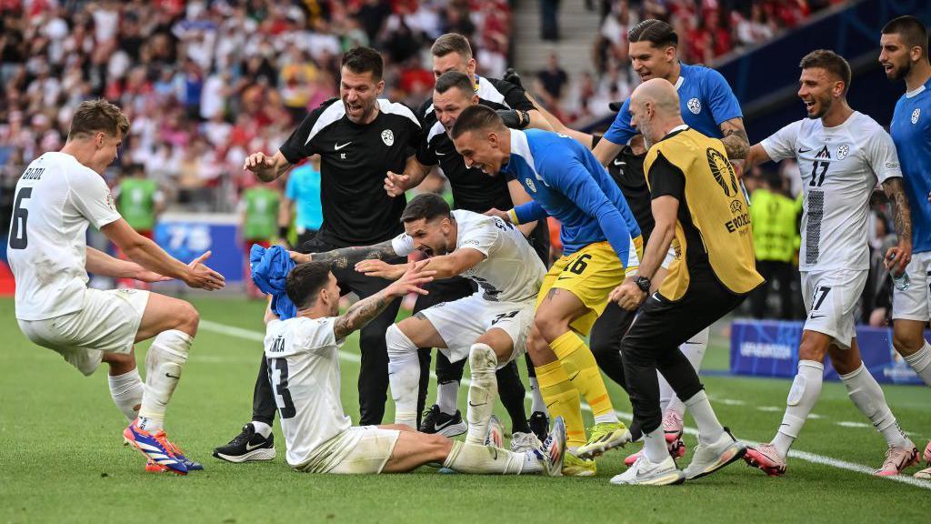 Slovenia celebrate scoring against Denmark