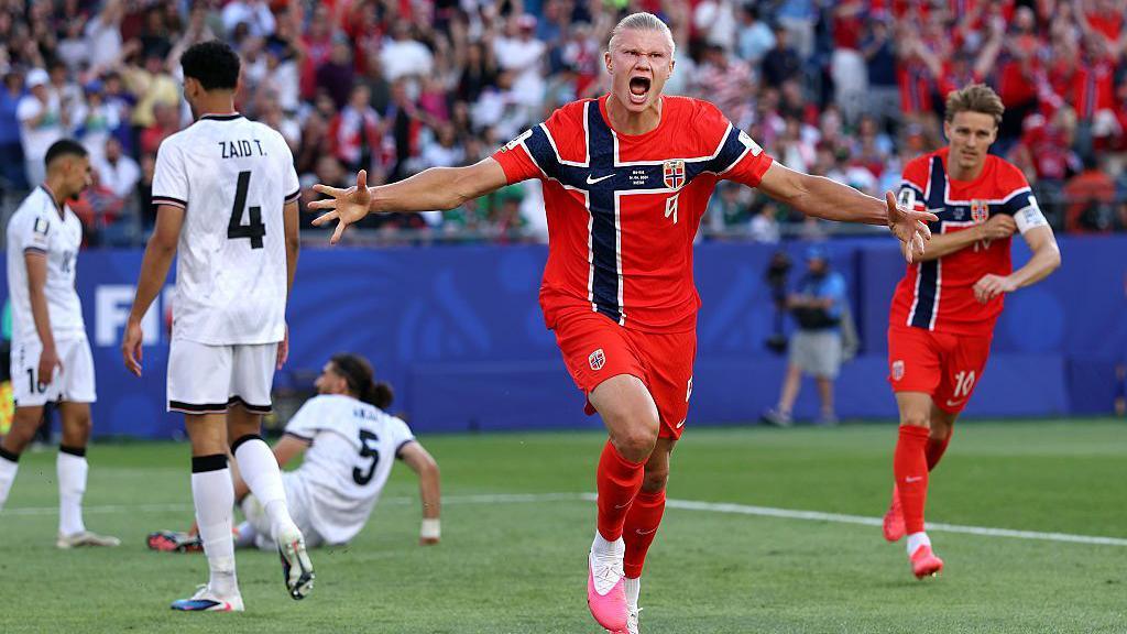 Haaland celebrating after scoring.