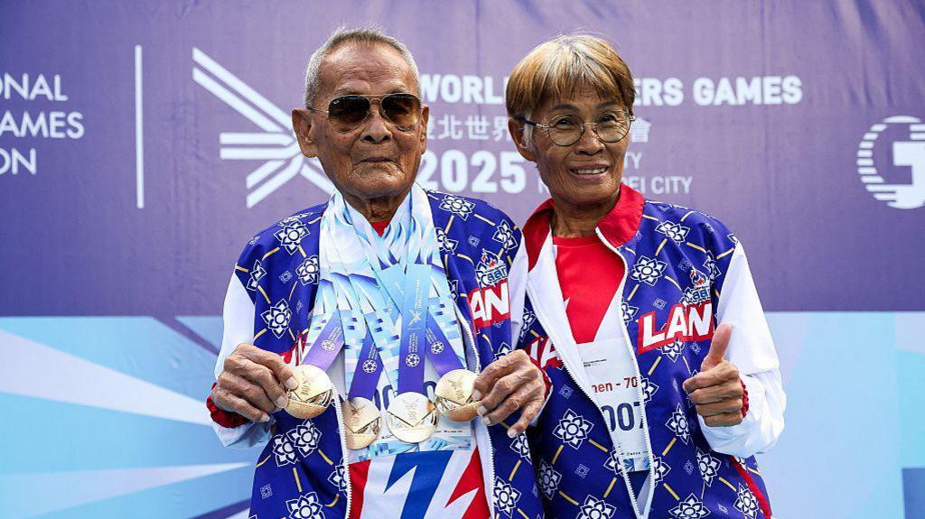 Sawang with his daughter Sirian