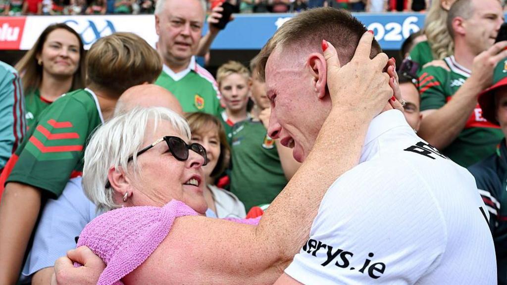 Ryan O'Donoghue is congratulated by his mother Brenda