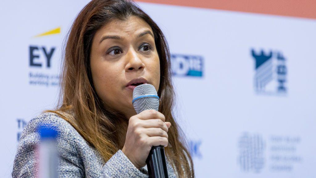 Tulip Siddiq speaking into microphone