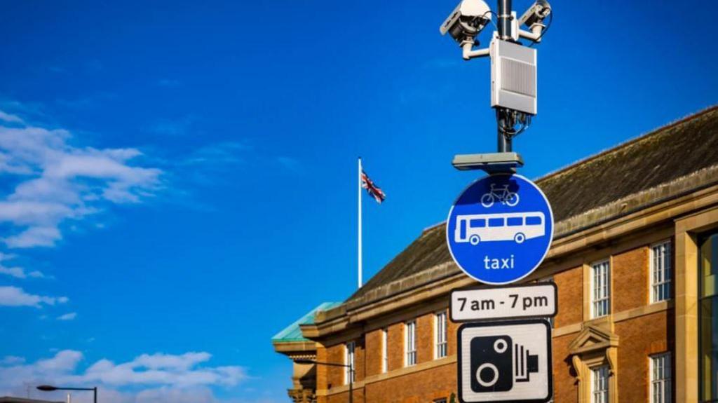 View of the bus lane camera with signage outside Derby's Council House