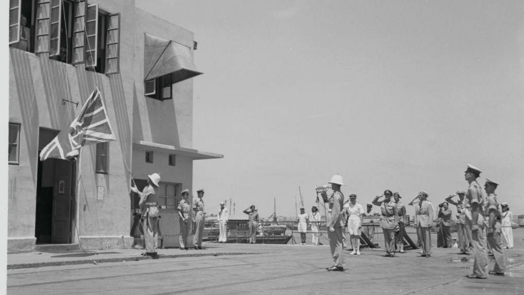 A British marine lowers the Union Flag to officially end British rule in the Palestine in 1948